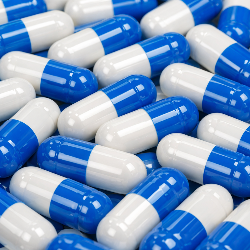 upclose image 4k quality blue and white pills scattered-1