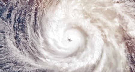 Satellite view of a hurricane spiraling over the ocean