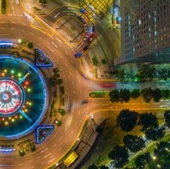 a city roundabout at night represents circular movement