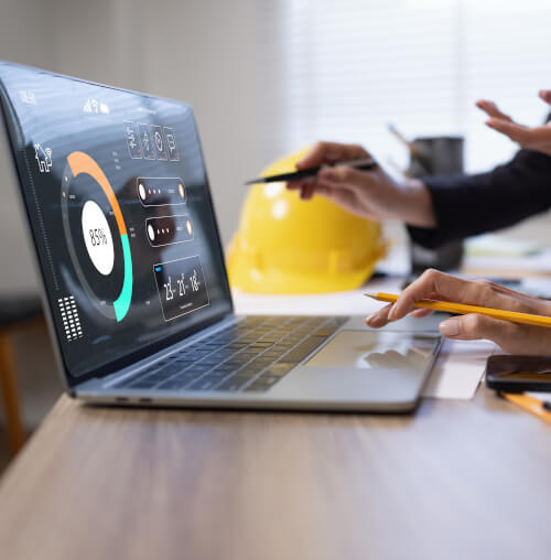 Laptop open with logistic pie chart on the screen