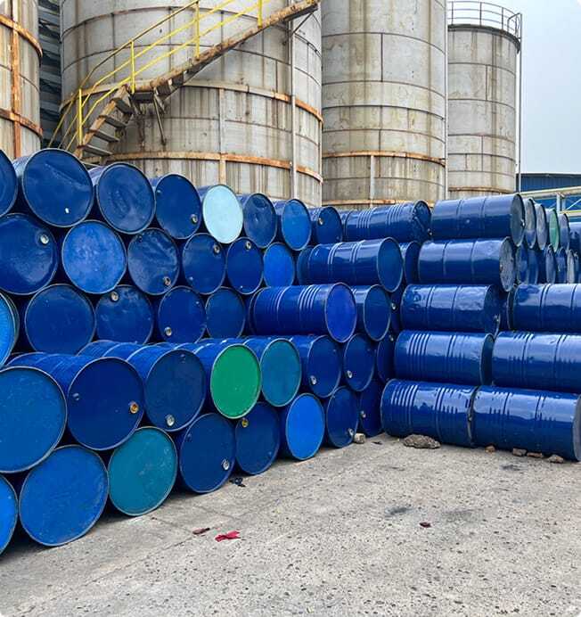 Barrels of waste piled up.