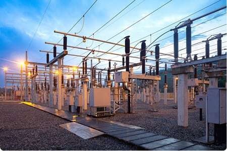 An electric utility switchyard at sunset