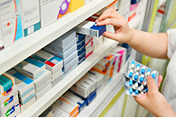 Medication on pharmacy shelf.