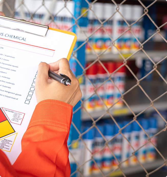 Worker checking on the hazardous chemical material information form. 