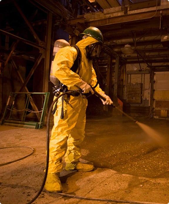 High-pressure water blasting industrial cleaning.
