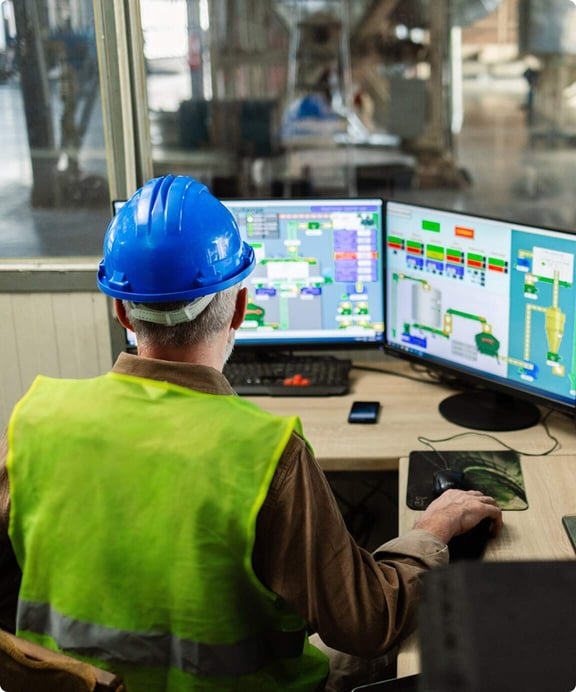 Facility manager reviews data on recycling.