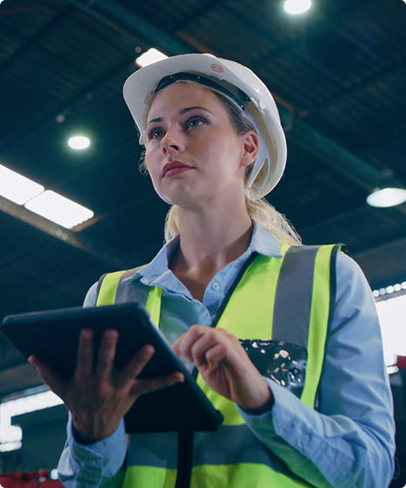 Woman in factory reviews PFAS disposal options.