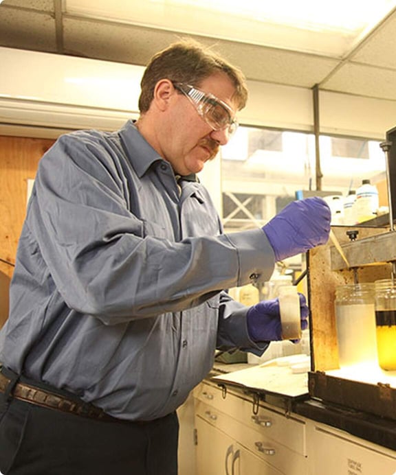 Reworld employee tests wastewater in the lab