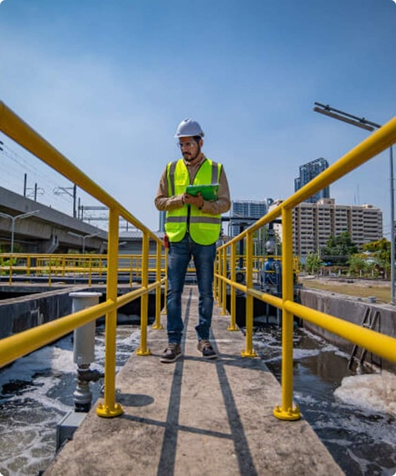 Employee surveys wastewater tanks