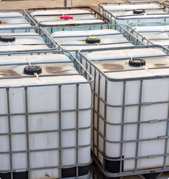 Totes containing waste from energy utility facility.