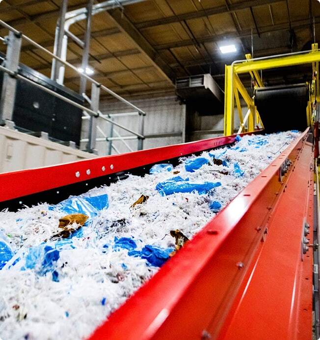 Industrial waste on a conveyor to be converted into alternative fuel.