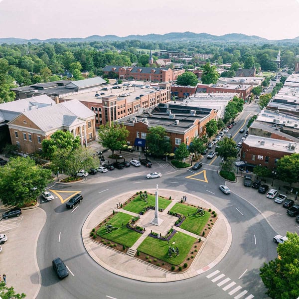 Overhead view of municipal downtown with traffic circle.