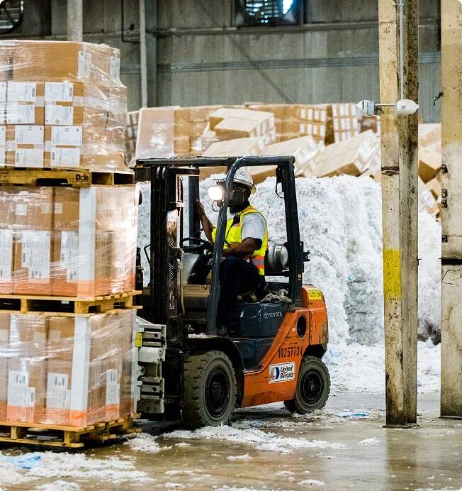  Forklift moves waste in Reworld facility.