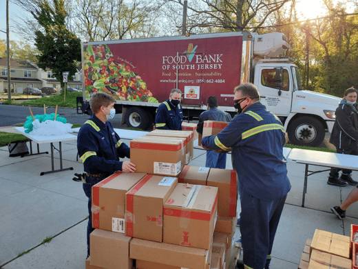 employees distribute food at event