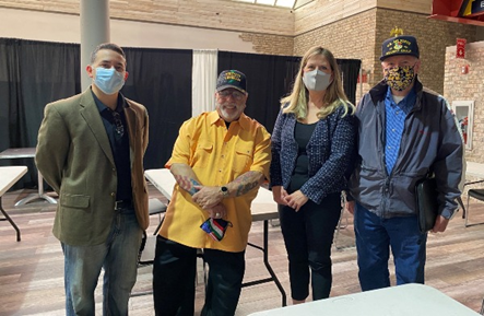 Maureen Early poses with members of veterans committee