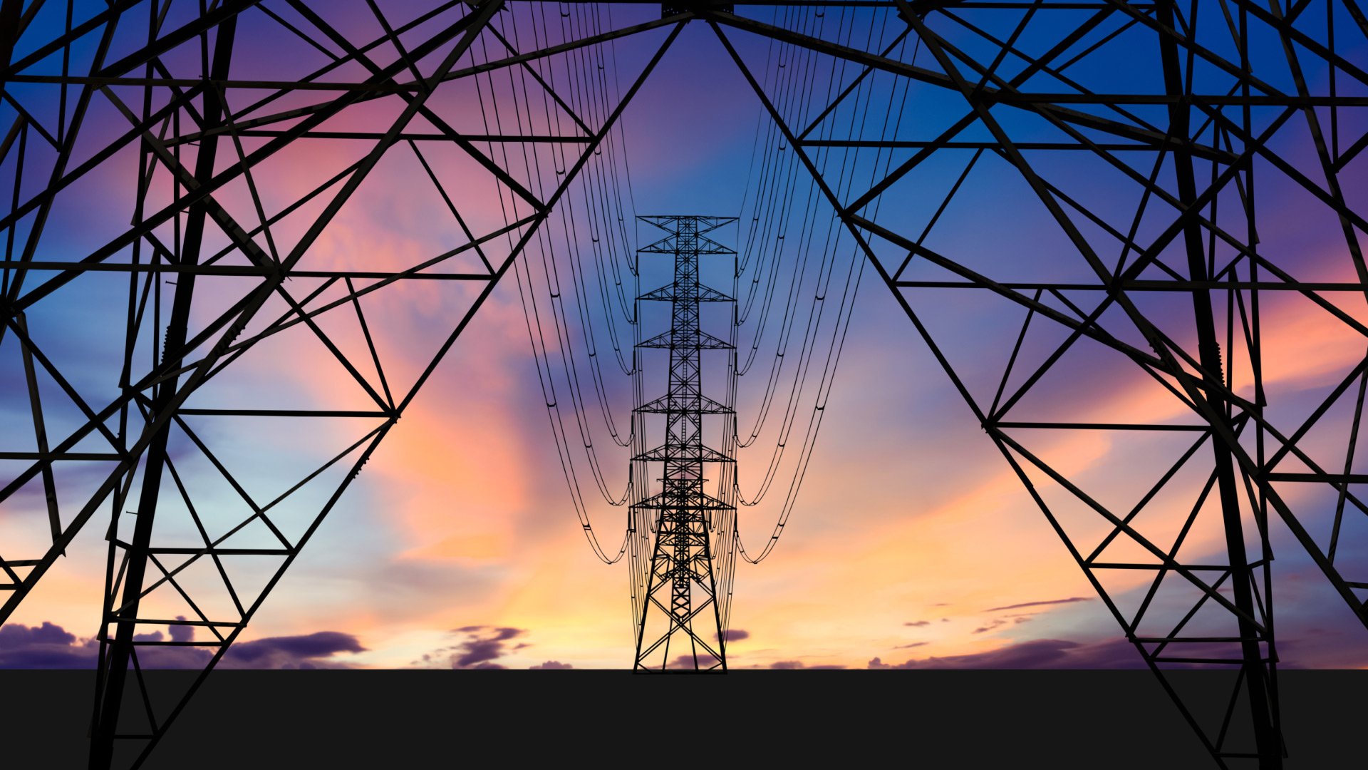 electrical transmission towers and wires at dusk